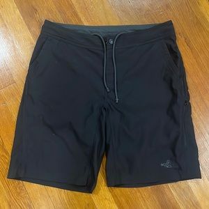 Men’s black North Face swim trunks, size 34
